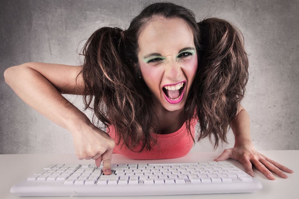 Mad woman striking keyboard