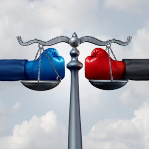 Boxing gloves on scales of justice